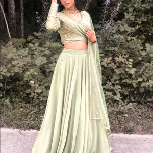 Lengha in pistachio green with duputta.